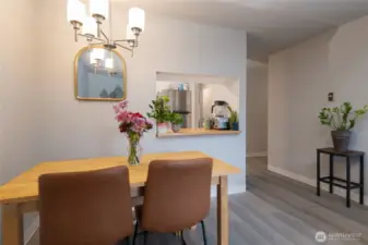 Dining area with convenient pass-through to the kitchen—perfect for easy serving and conversation while entertaining.