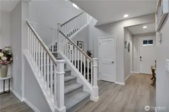 Convenient coat closet & drop zone across from garage.