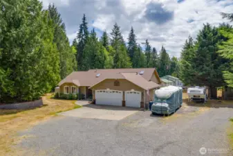 Plenty of parking for RV's and guests. A great home for entertaining! Large 3 car garage, generator, heat pump AC and more!
