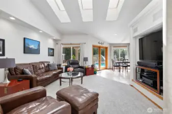 Living room/Great room with built-in entertainment area, gas fireplace, lots of windows and skylights make this room so light and bright!