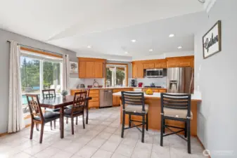 Kitchen and breakfast bar off dining area.