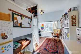 Ladder to the left of photo leads to loft bed, large enough to fit a queen size.