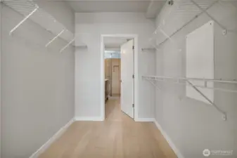 Primary bedroom walk in closet