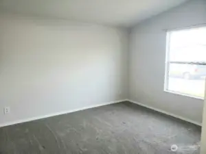 A Picture of the Really a Nice Size Second Bedroom Showing Newer Trim, and Carpet.