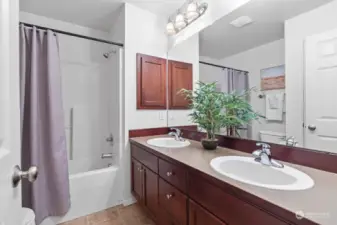 Upstairs guest bathroom with double vanity ideally situated.