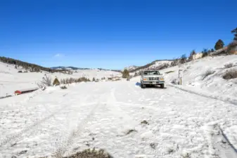 Additional parking area, RV parking, large area with power and water. This is where seller had a Noble Panel barn set up for horses at one time.