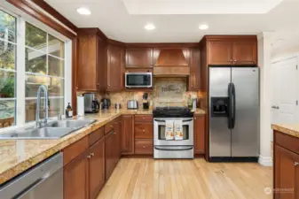 Beautiful cabinets with granite and stainless steel appliances