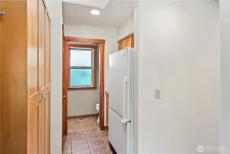 This is pantry off of the kitchen looking towards the half bath.