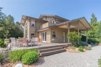 The expansive deck looks towards the Olympics and private 4+ acre property.