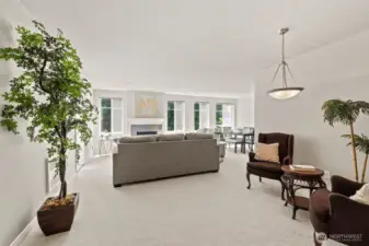 Open space living with large windows allowing for brightness from natural  lighting.