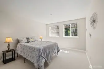 Primary bedroom is large. This is a queen bed and you can see a King would fit easily with lots of space left over.