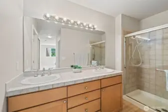 Primary bathroom.  Vanity has lots of storage space, double sinks with plenty of counter space. Shower is large as well.