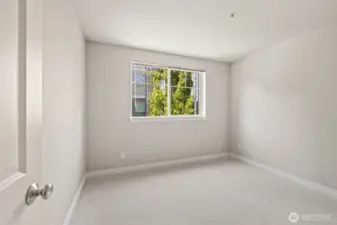2nd bedroom is a good size that this picture doesn't quiet capture. Has a large closet & large window.
