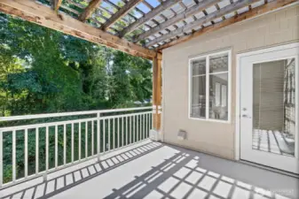 The deck is off the living room and is a good size. The open overhead slats provide enough shading while not taking away from the warmth of those sunny days.