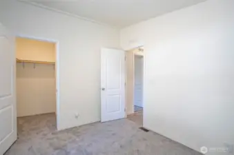 Guest Suite #1 boasts a spacious walk-in closet for added storage and convenience.