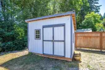 Nice view of the shed featuring double doors.