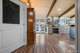 The open concept kitchen, living and dining room feature new updates throughout.