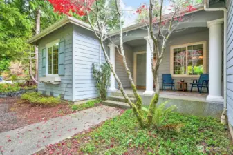 The season may have shifted, but this charming front entrance and patio offer a lovely welcome into an exceptional single-level home.