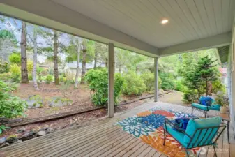 Enjoy this covered back patio throughout the seasons—perfect for summer gatherings or adding a cozy outdoor stove in winter to stay warm while you relax.