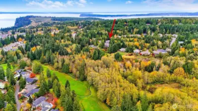 Aerial: This home enjoys a prime location near the Port Ludlow Golf Course, marina, local dining, and miles of maintained hiking trails—perfectly blending convenience with scenic surroundings.