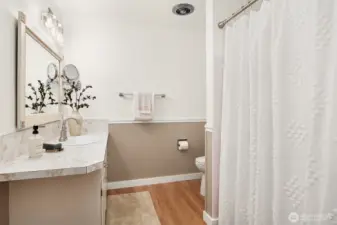 Charming bathroom serves 2 bedrooms, updated fixtures and paint.