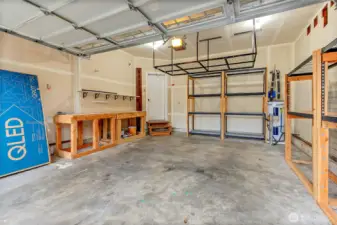 Garage with workbench and storage shelving