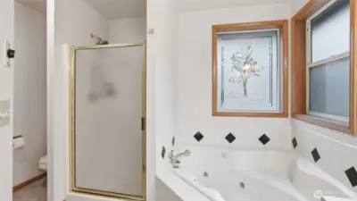 Primary suite bathroom with newly updated counters and flooring