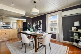Natural light, wood floors, and classic trim details give the dining room a relaxed elegance perfect for both everyday meals and special gatherings.