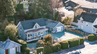 The property’s generous lot and detached shop stand out in town, offering space and flexibility rarely found this close to the waterfront.