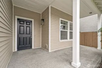 Nicely covered front porch allows entry out of the elements.