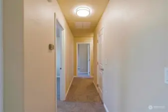 Hallway to Bedrooms - Pantry closet door on right