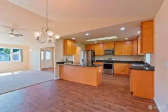 Open concept with some delineation - Large open kitchen w/ skylight