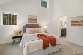 Upstairs bedroom #1 with vaulted ceilings and jack-and-jill bath.