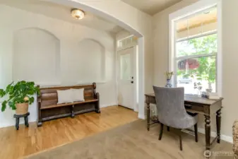 Grand entry with large windows letting in all that natural light. Tall ceilings add to that light and bright ambiance!