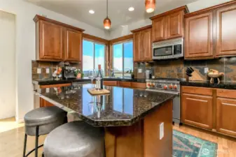 Refined kitchen is large with room for everyone
