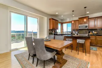 Dining area with eat-in kitchen is perfect for quick bites or large parties