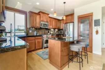 Huge kitchen with tall cabinets and pantry is ready for your next dinner party