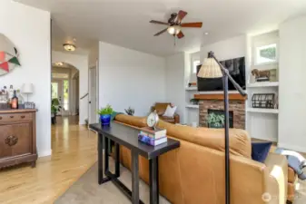 Open floor plan with ceiling fans and wood flooring throughout. Convenience and functionality blend perfectly in this home!