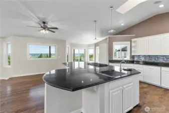 ENORMOUS chef's kitchen boasting two ovens, grill top, gas range, two sinks, and more!
