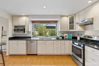 Big open kitchen and an eating area at the bar. You can be in the kitchen and keep an eye on what's happening in the backyard.