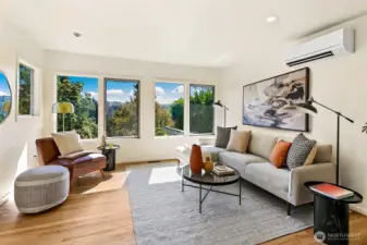 Main level living area also faces south, overlooking the backyard garden.