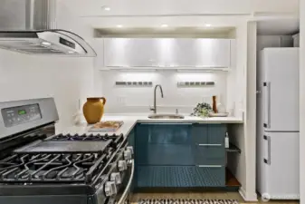 The second kitchen has a gas stove, and gleaming, efficient modern cabinetry. Lovely for guests or as a nice family room perk.