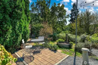 Enjoy a morning coffee or an afternoon refresher out on this charming brick patio. All day sunshine available in this south facing yard.