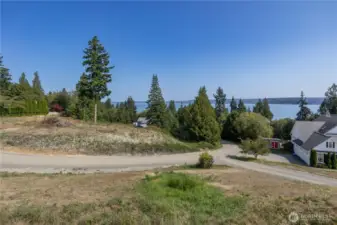 Looking NE from the edge of the lot, you can see the expansive views. The two private roads dead end and there are  few homes, so you'll enjoy quiet and privacy in this lovely community.