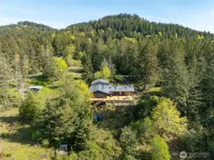 Sited on 6.5 acres of forest and pasture between the ferry landing and the main village of Eastsound.