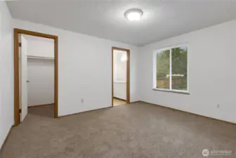 Primary bedroom offers brand new carpeting, walk in closet and full bath