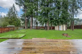 French door from dining area opens to oversized newer deck, creating a seamless indoor-outdoor flow perfect for entertaining or relaxing