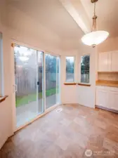 BREAKFAST NOOK AND SLIDER TO BACKYARD