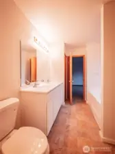 REVERSE OF THE PRIMARY BATH LOOKING TOWARD BEDROOM