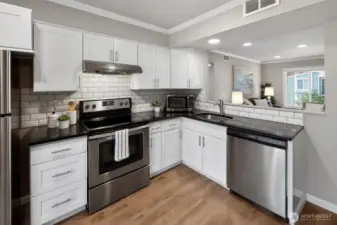 Updated kitchen with stainless steel appliances.